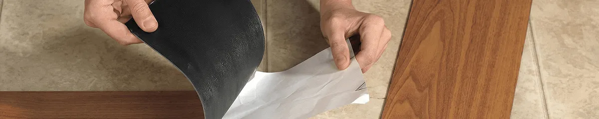 A professional installing vinyl flooring in Louisville, KY
